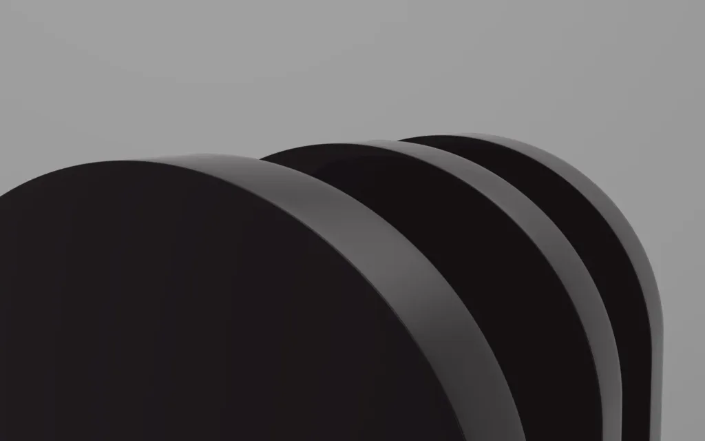 Three overlapping black curved panels on a grey background