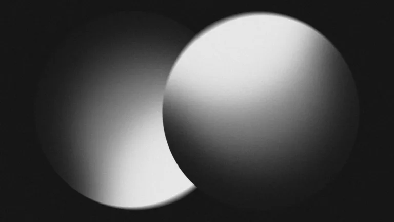 Two overlapping spheres in monochrome light and shadow