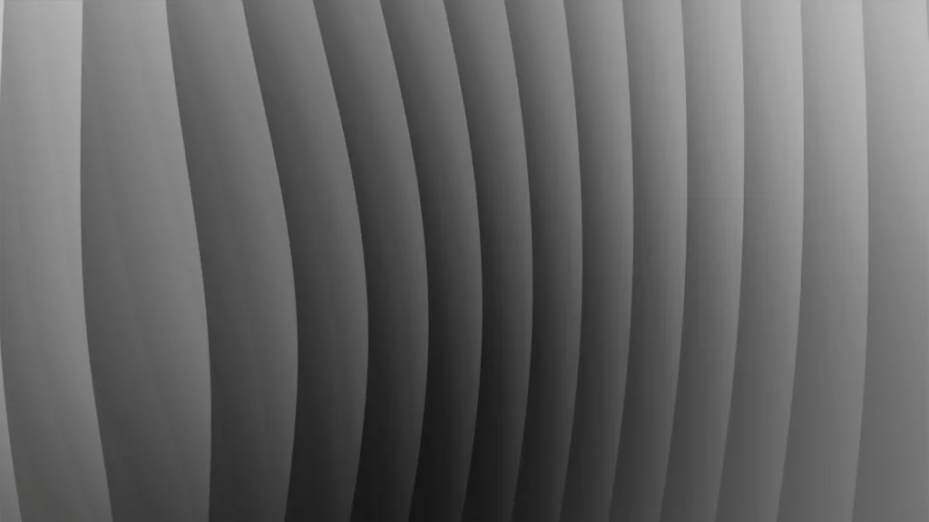 Fluted grey surface curving through gradient light