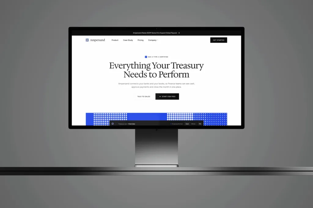 The Ampersand homepage, Everything Your Treasury Needs to Perform, on a Studio Display against a grey wall