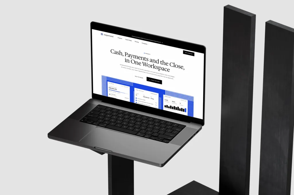 The Ampersand product page, Cash, Payments and the Close in One Workspace, on a MacBook Pro on a black stand