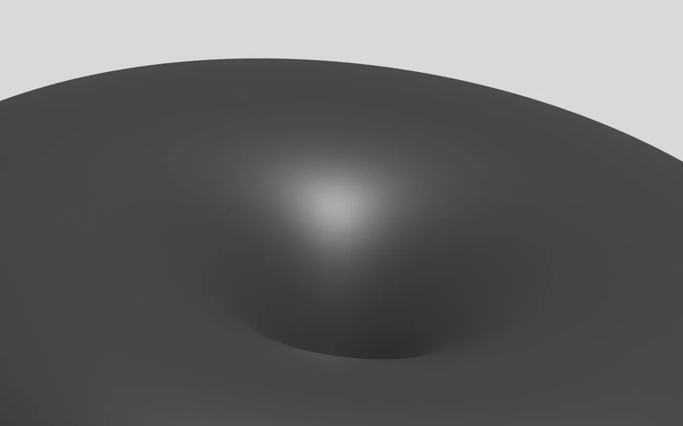 A dark rounded form dipping into shadow