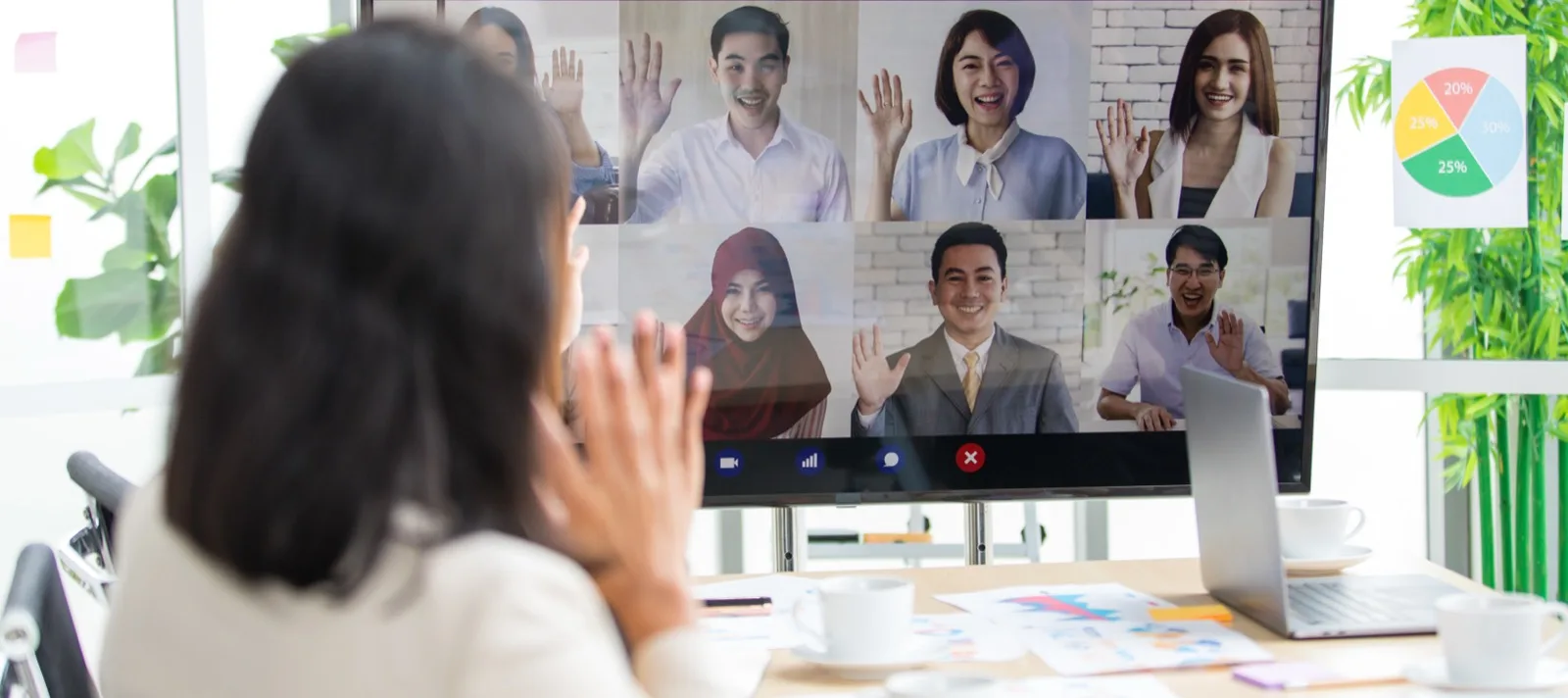 A distributed product team on a video call reviewing work across timezones