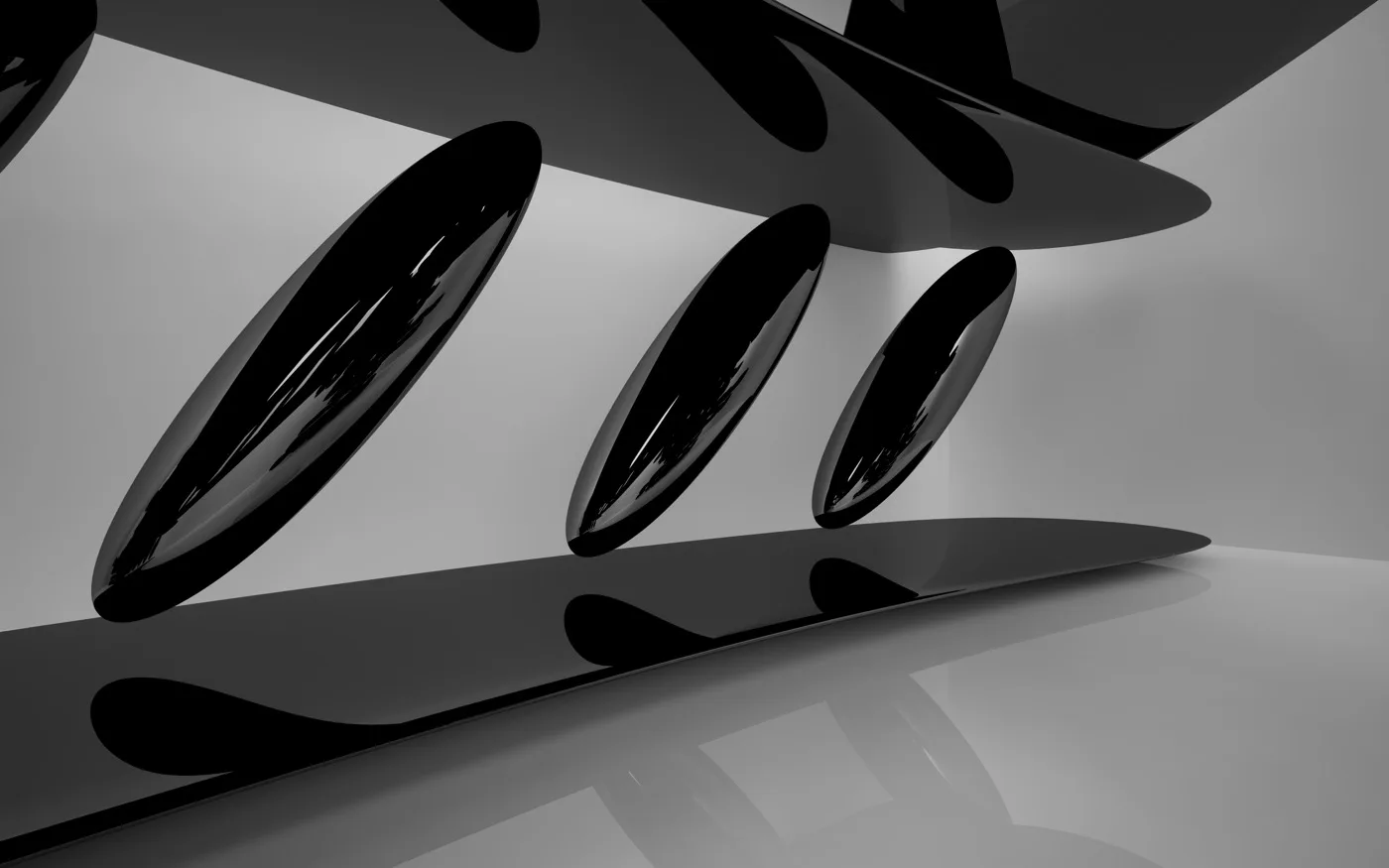Glossy black ellipses casting long shadows on a pale floor