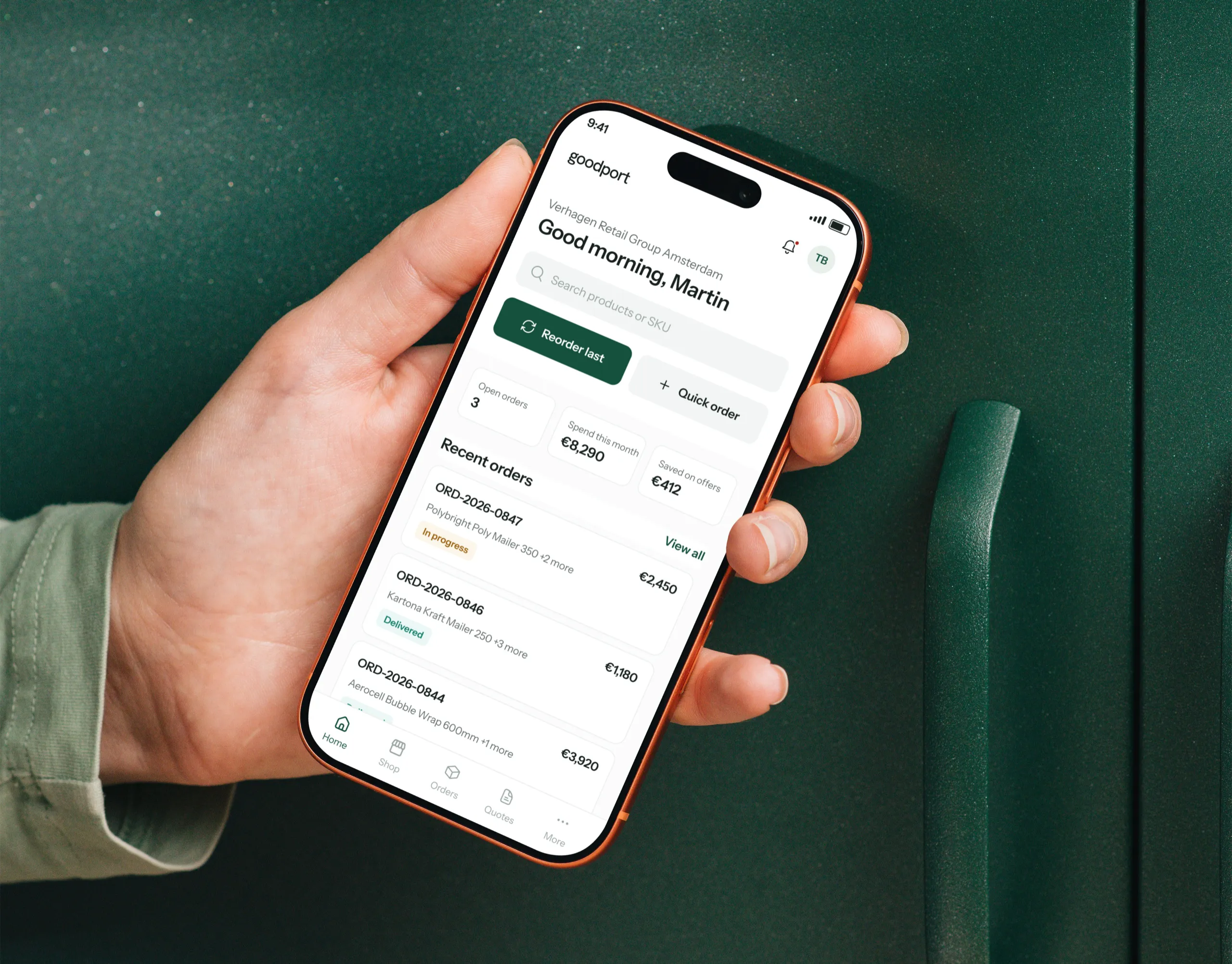 goodport customer portal on an iPhone held against a green wall