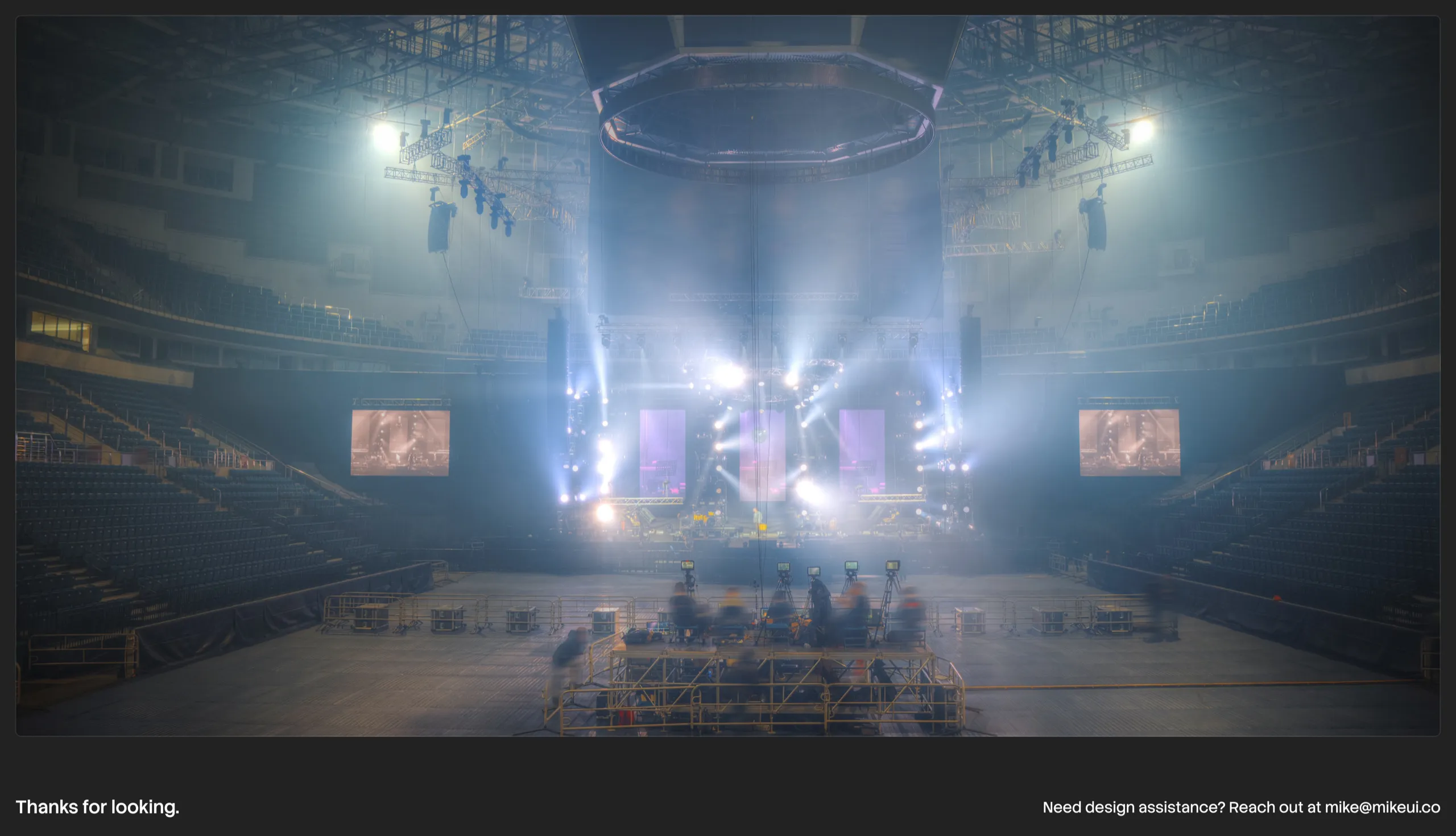 An arena before doors open, closing the case study with Mike's contact email