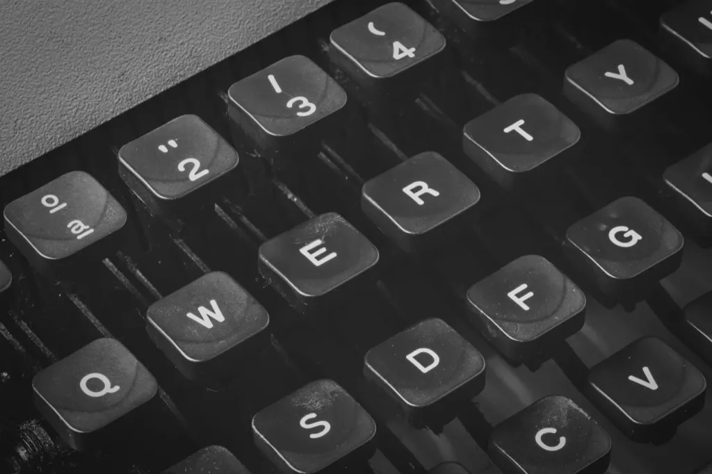 The keys of a vintage typewriter in black and white