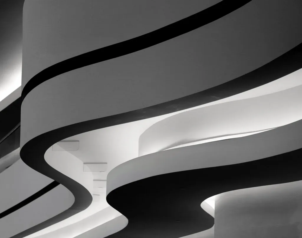 The curving white balconies of a building in Berlin, in black and white