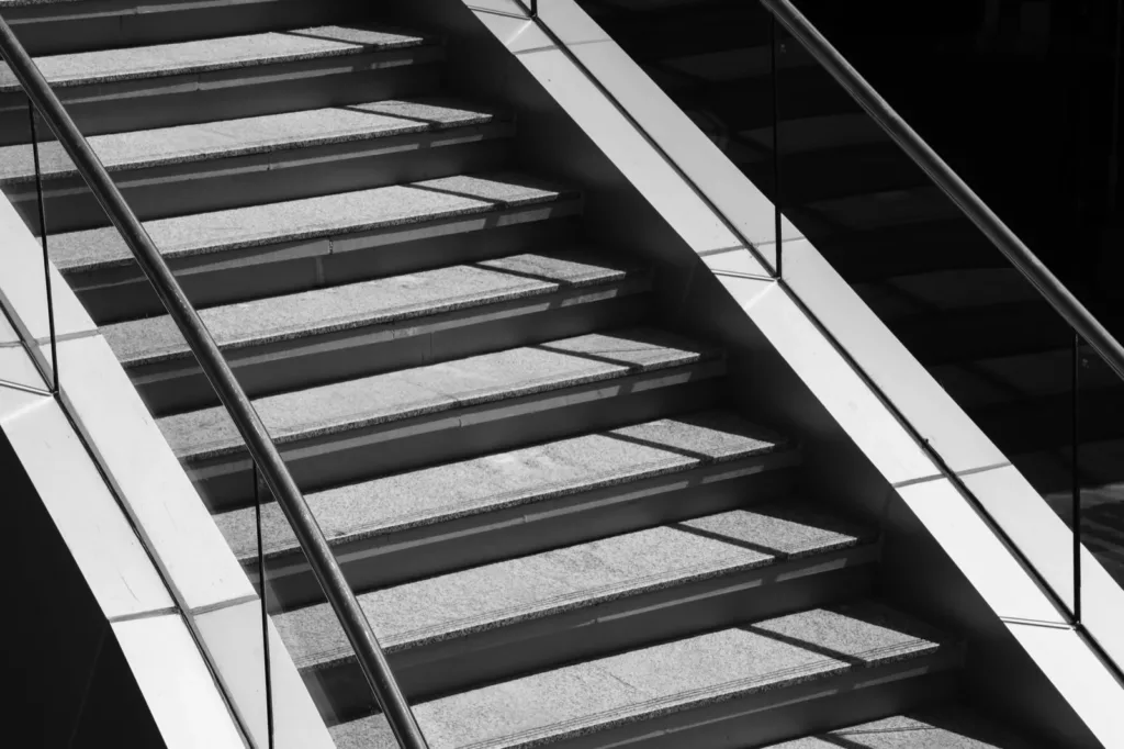 Concrete stairs and their shadow in black and white